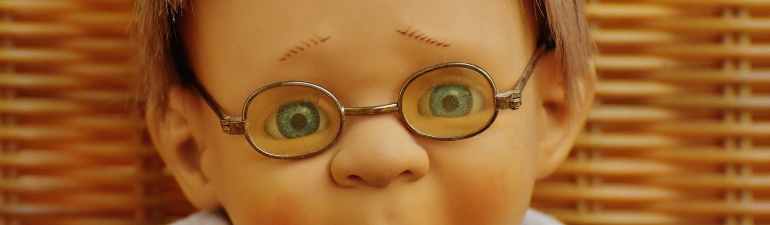 doll wearing eyeglasses